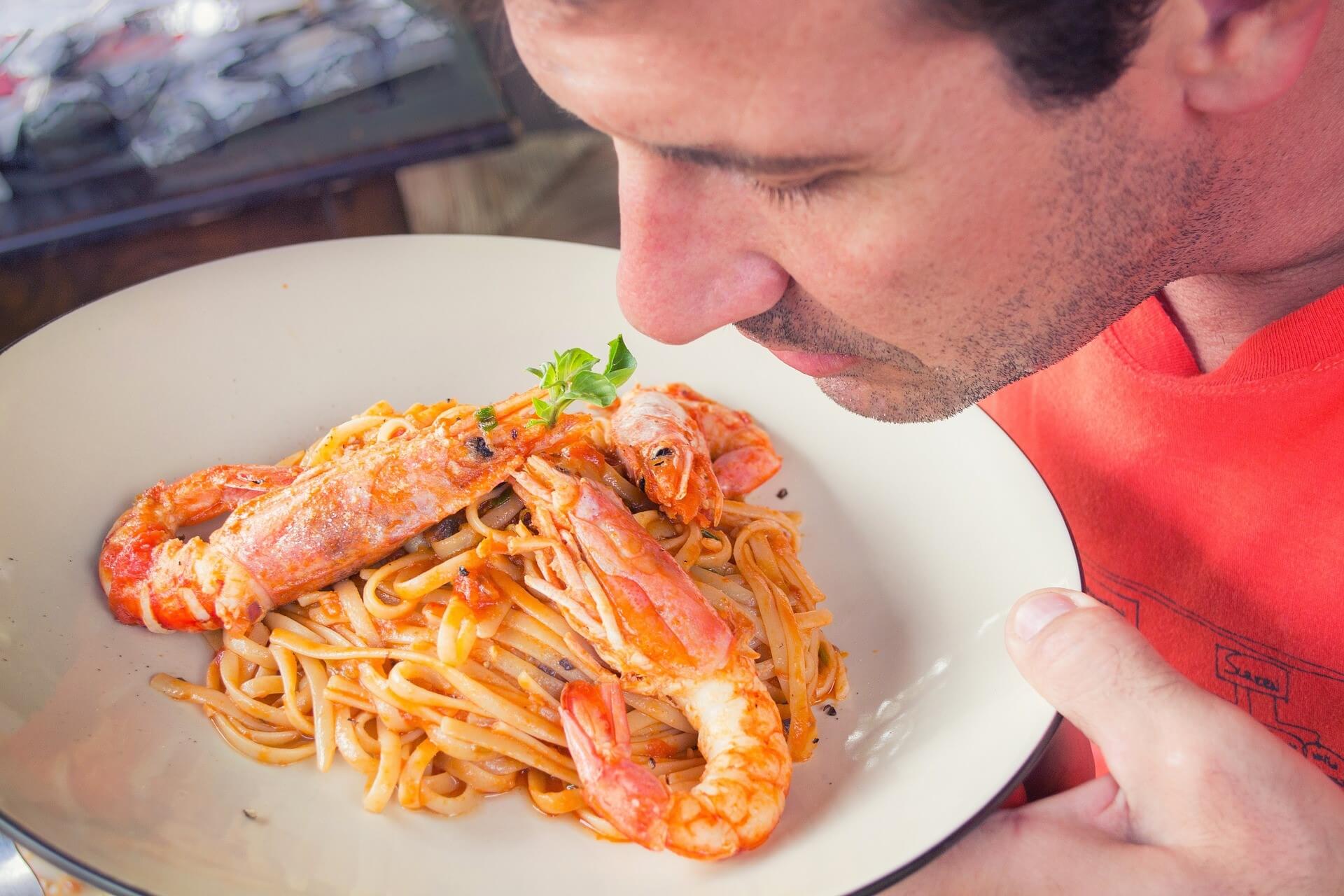 Perfectly cooked prawns over pasta