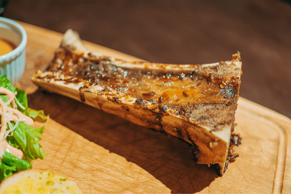 Cooking bone marrow in high heat yields a nicely caramelised bovine treat.